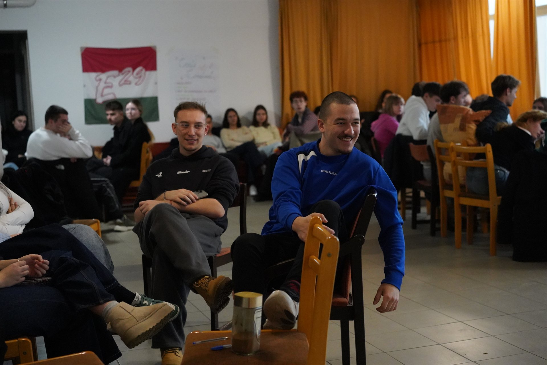 Two participants laughing together