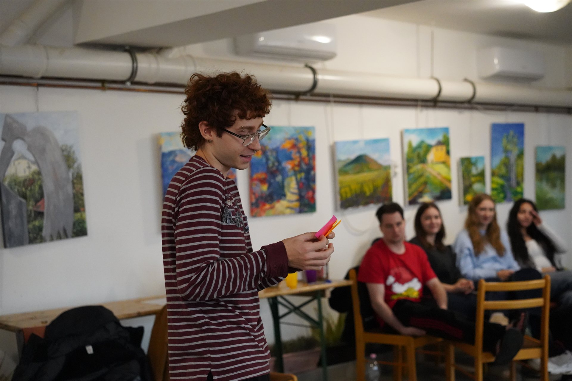 A participant presenting with colored cards