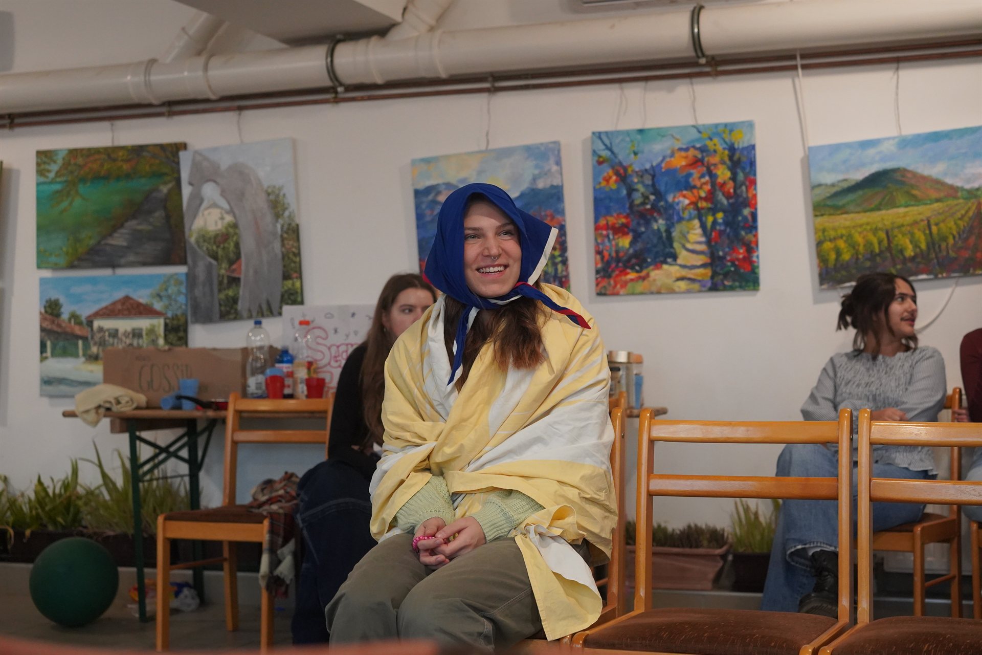 A participant wrapped in a blanket during a game