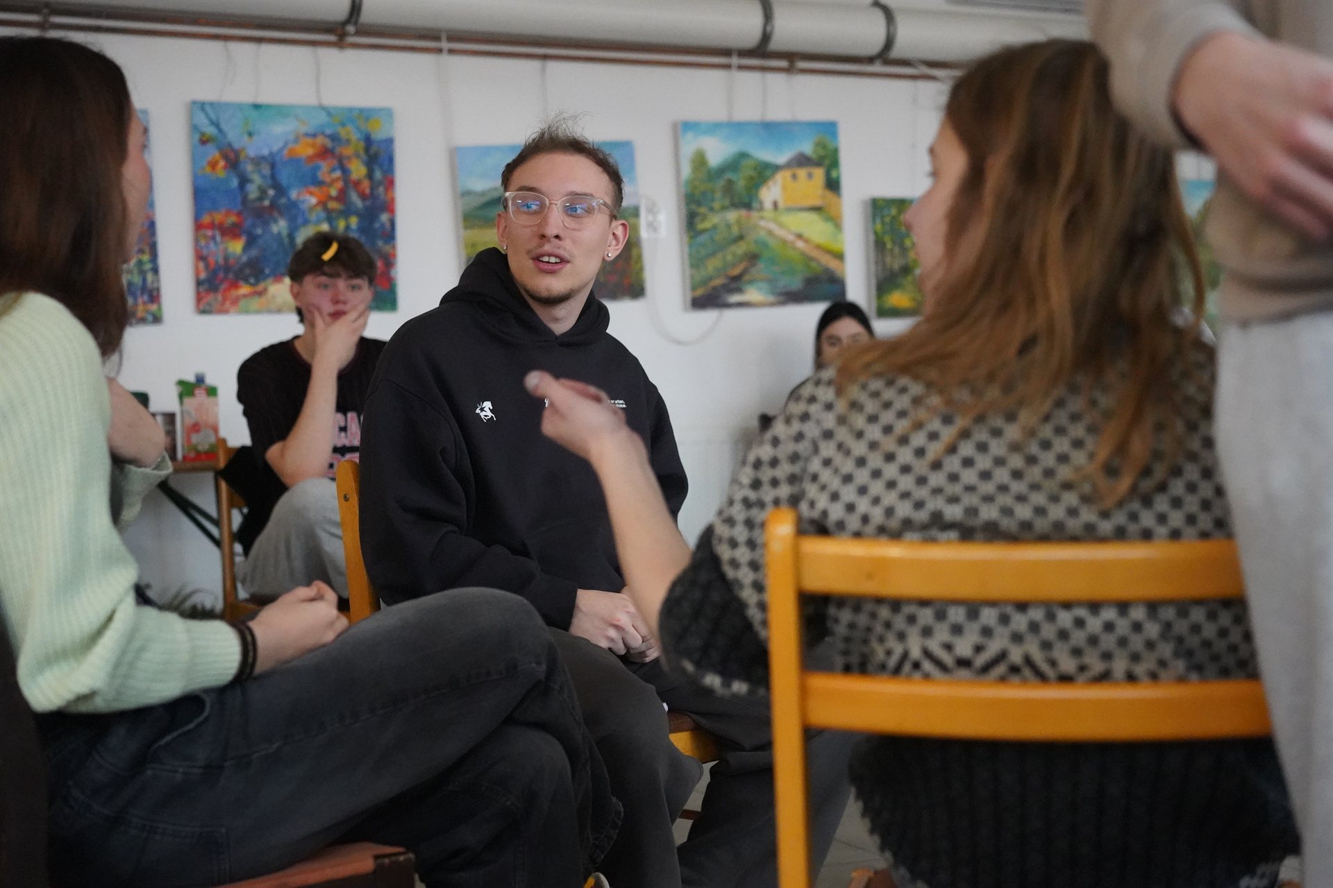 A participant speaking up in a group discussion