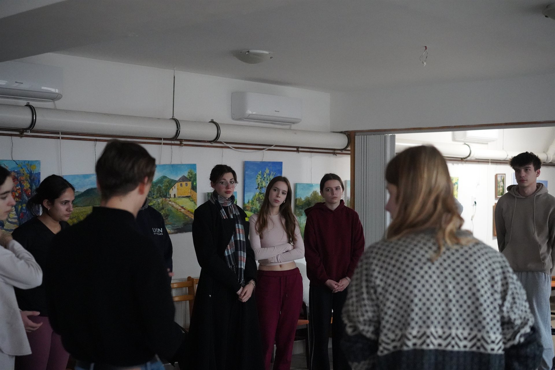 The group standing together in a listening circle