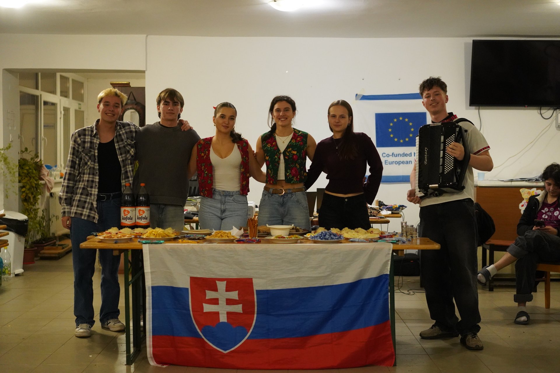 Our Slovak group hosting their cultural night, behind the Slovak flag