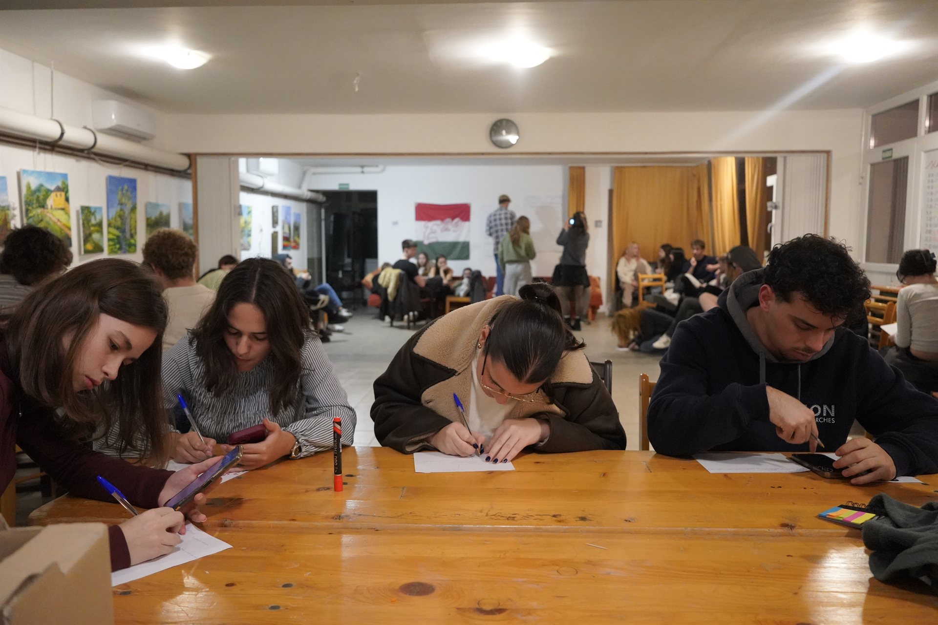 Working through a task together at a long table