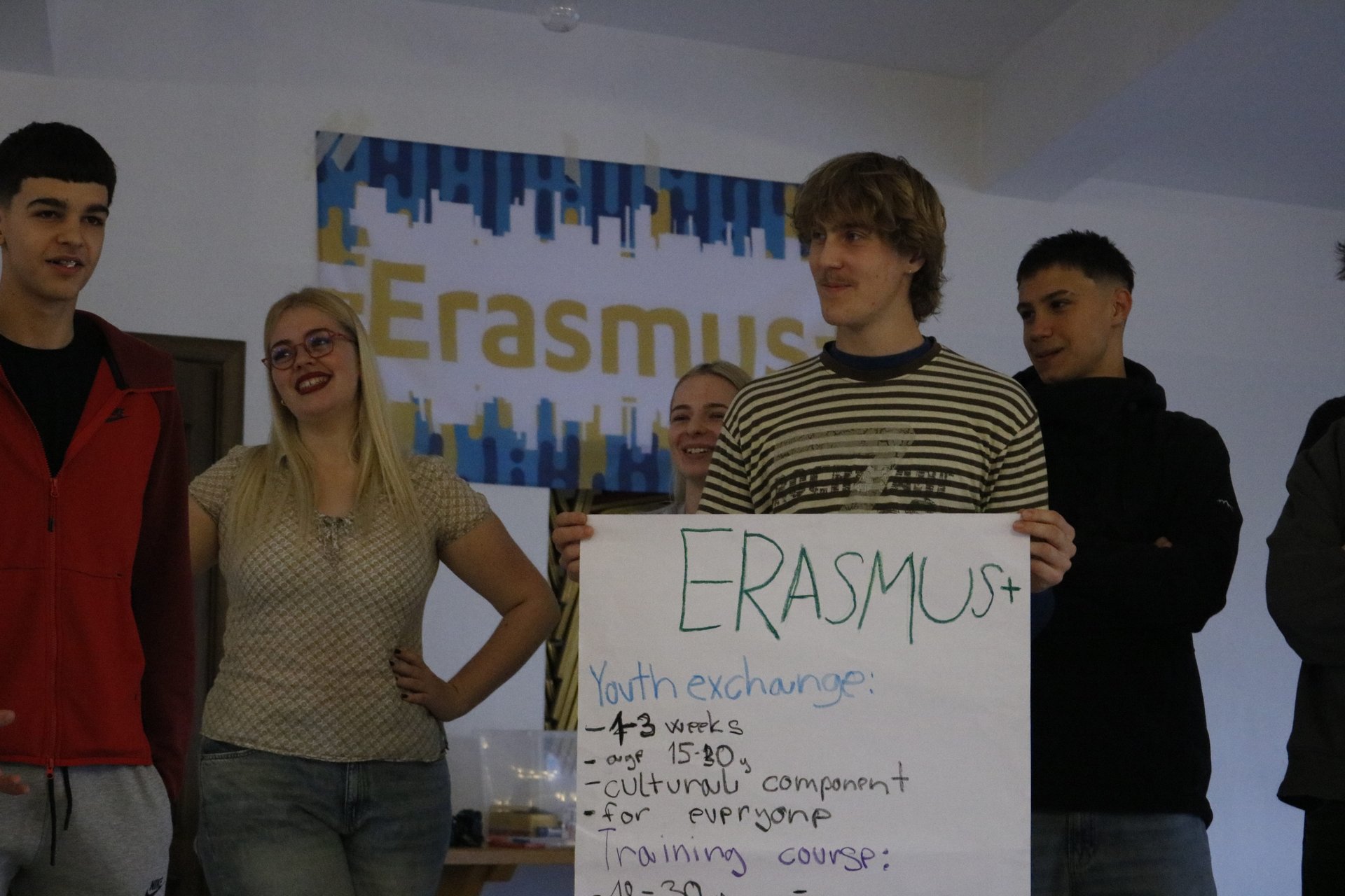 A participant showing a handmade poster