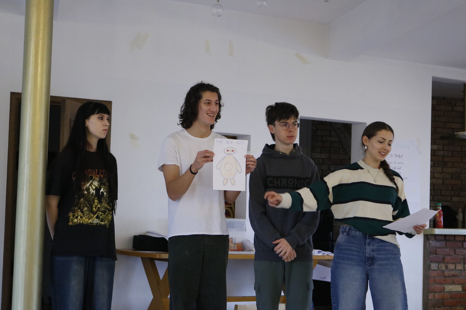 A small group presenting their sheet of work