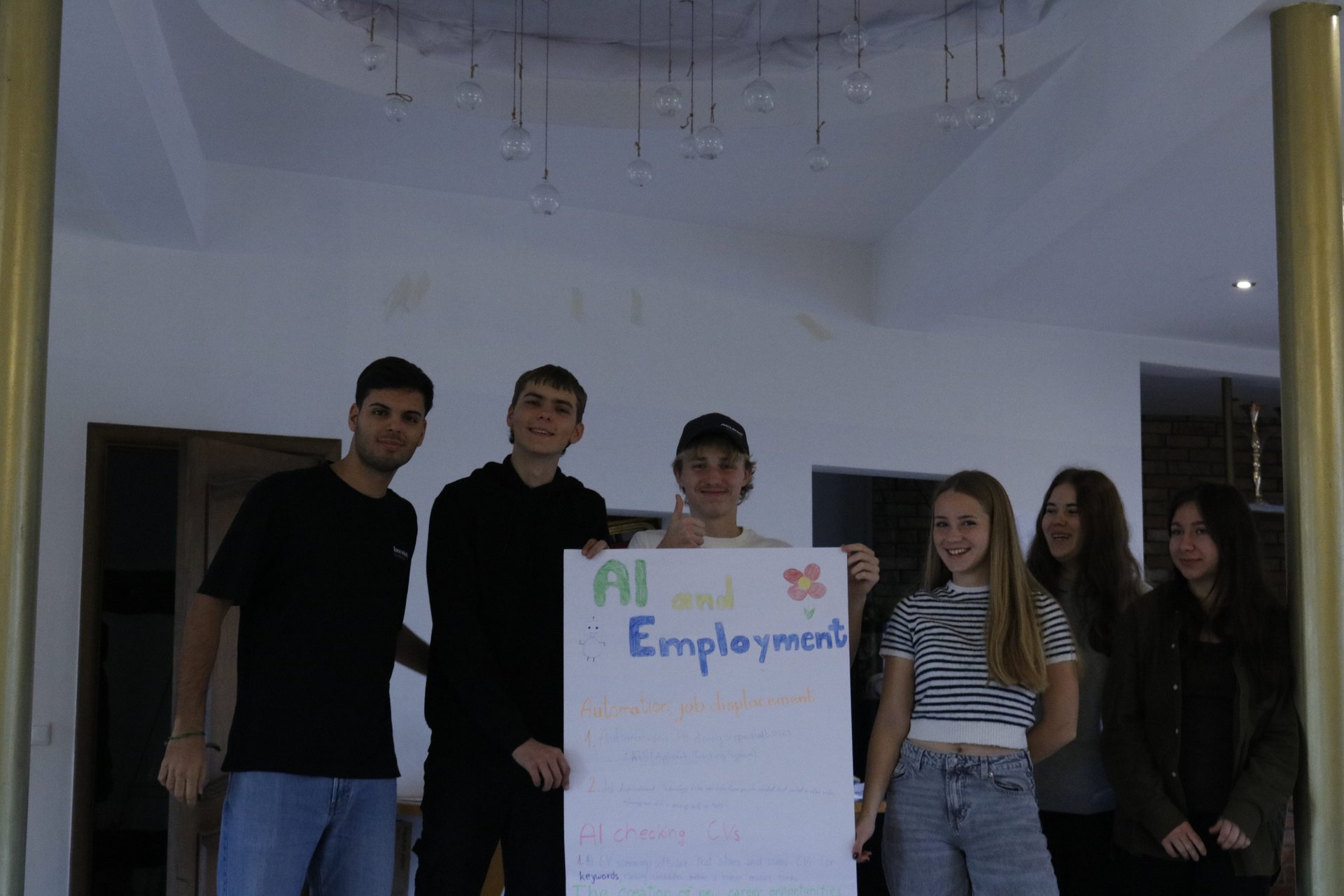 A team presenting their poster