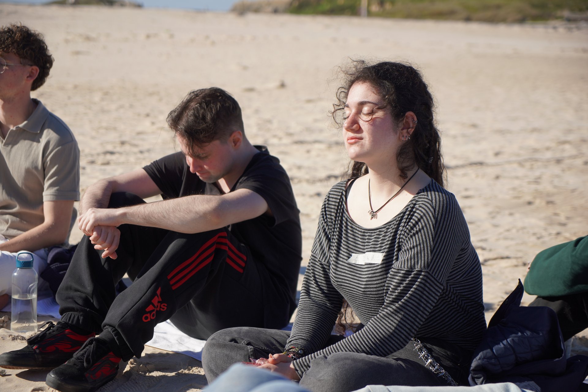 Participants in the guided beach meditation