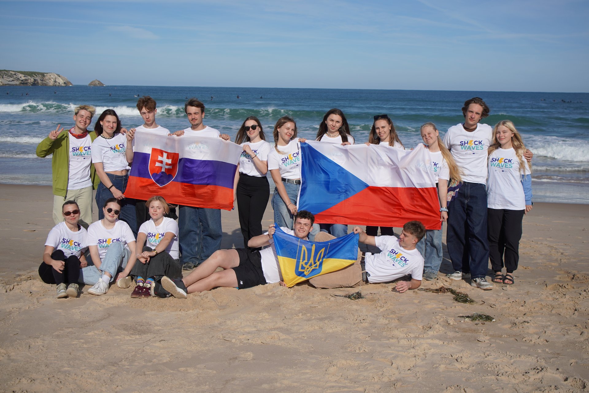 The group celebrating together on the beach