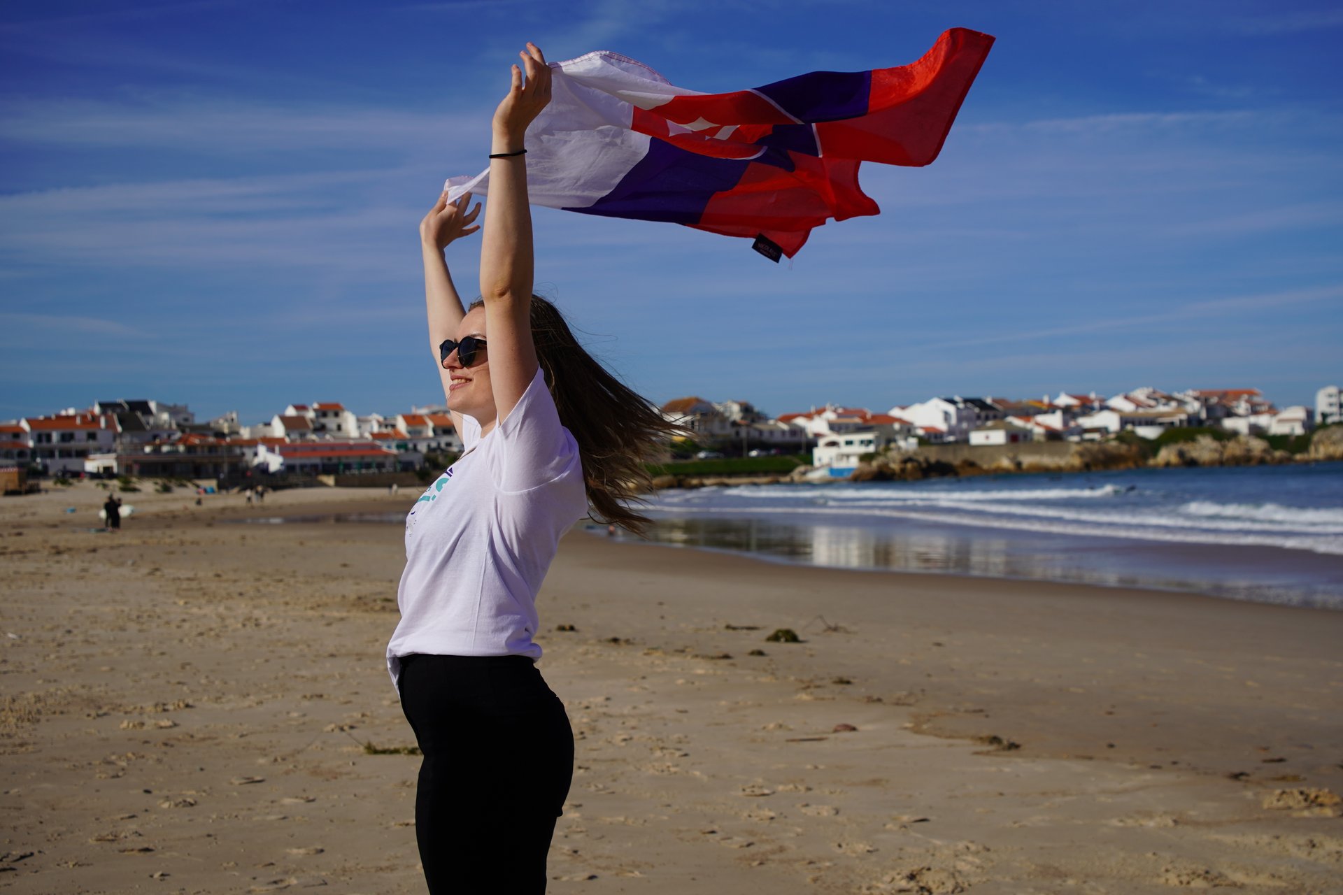 A flag flying on the Peniche shore